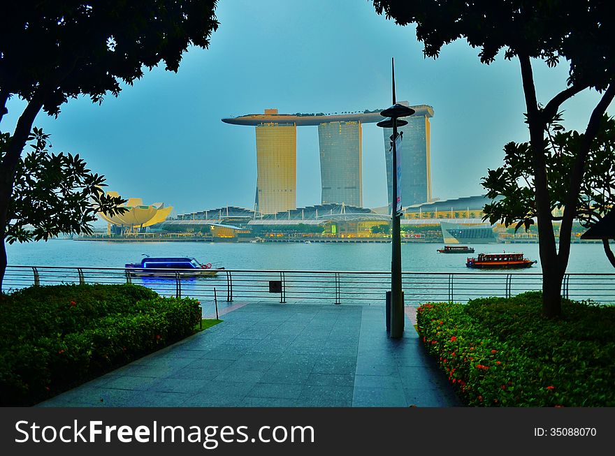Marina Bay Sands is an Integrated Resort fronting Marina Bay in Singapore. Developed by Las Vegas Sands (LVS), it is billed as the world's most expensive standalone casino property at US$5.7 billion, including cost of the prime land. Marina Bay Sands is situated on 15.5 hectares of land with a built up area of 581,000 square metres of Gross Floor Area. iconic design have transformed the Singapore's skyline and its tourism landscape since it opened on 27 April 2010. The property has a hotel, convention and exhibition facilities, theatres, entertainment venues and shopping and dining retailers.