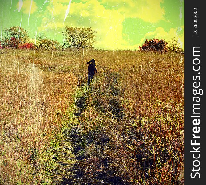 Grunge image of autumn landscape with kid running away. Grunge image of autumn landscape with kid running away