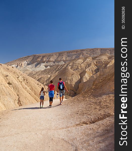 Active family walk in the wilderness summer day