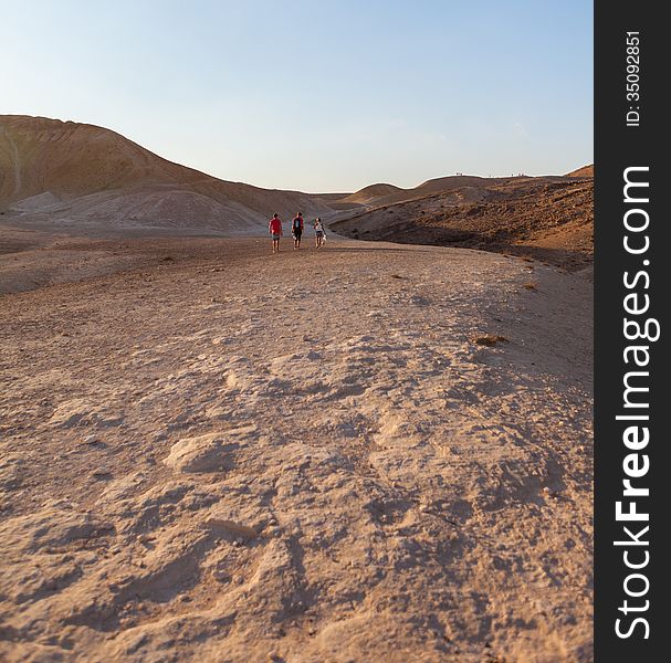 Joint active walk through the desert summer day