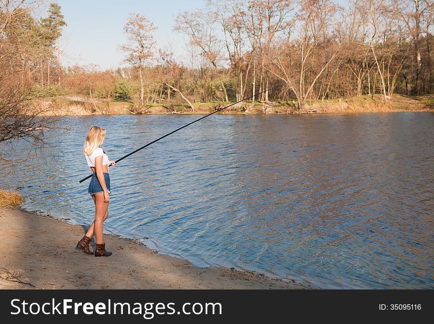 Woman fishing in river