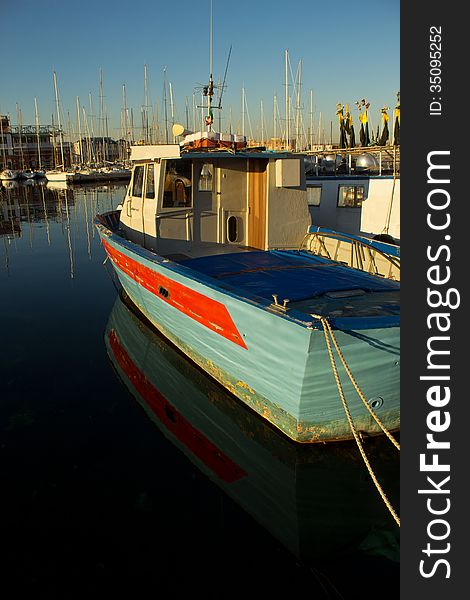 A fishermans boat in the harbour of the city of Trieste, Italy. A fishermans boat in the harbour of the city of Trieste, Italy
