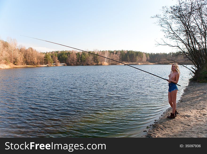 Topless Girl Fishing At The River