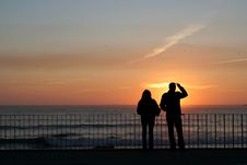 Couple Silhouette In Sunset Stock Image