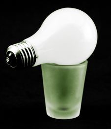 Lightbulb On Shot Glass Royalty Free Stock Photography Lightbulb On Shot Glass Royalty Free Stock Photography