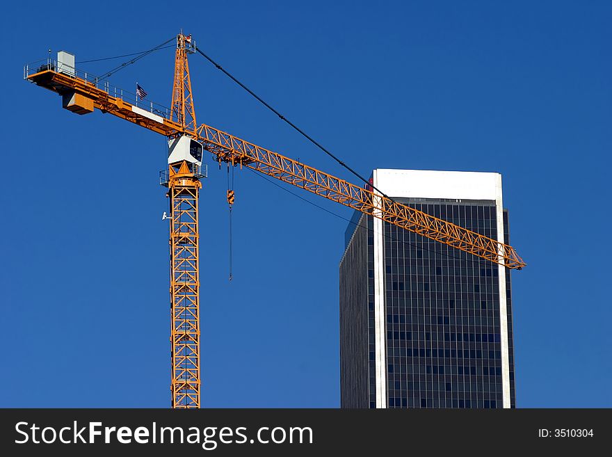 Condominium construction blue sky and huge crane