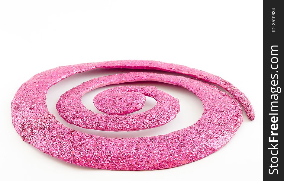 Pink glittering spiral ornament isolated on white background