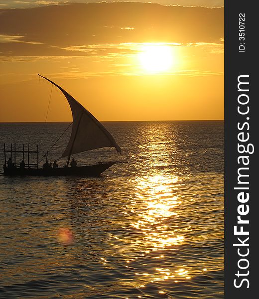 Dhow cruising on the ocean at sunset. Dhow cruising on the ocean at sunset