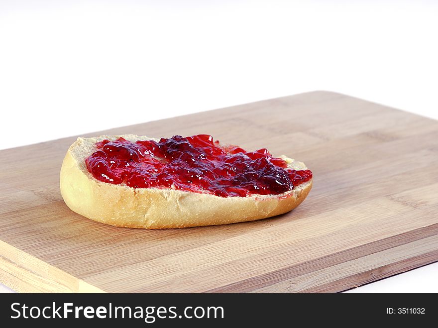 Breakfast baguette with jam on a white background. Breakfast baguette with jam on a white background
