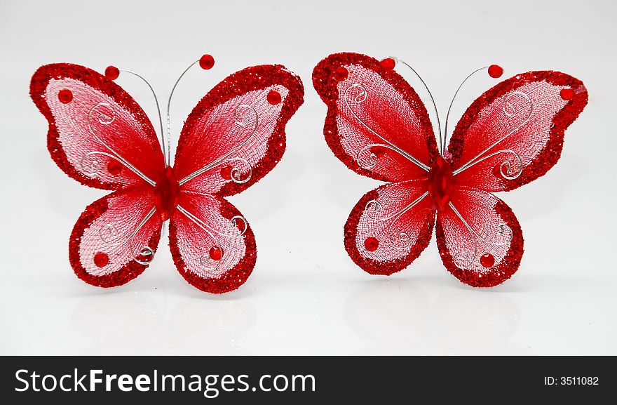 Focus a red butterfly image on the white background