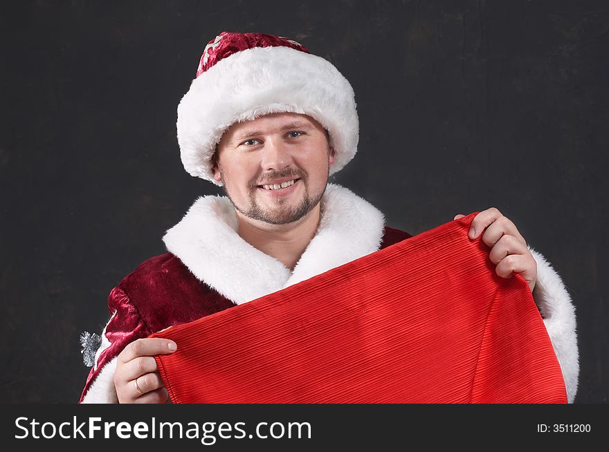 An image of smiling Santa with bag. An image of smiling Santa with bag