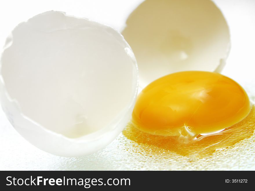 Brocken egg in front of a white background