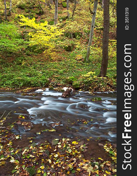 An image of river in autumn forest. An image of river in autumn forest