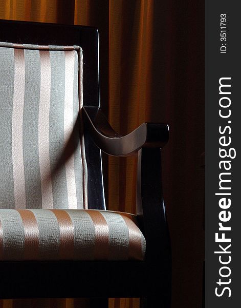 A armchair in hotel by a window