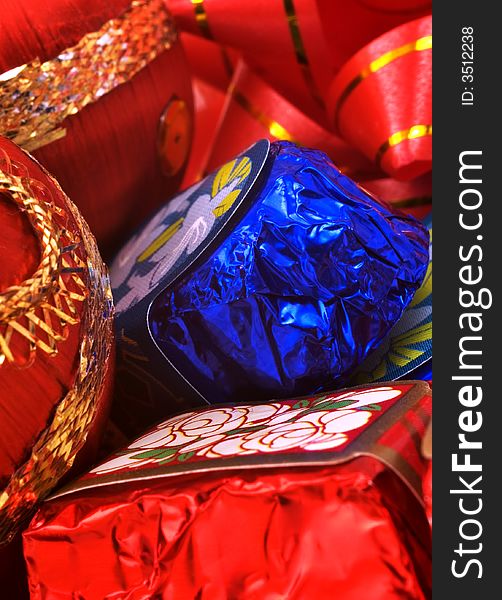 Chocolates and Christmas ornaments macro shot. Chocolates and Christmas ornaments macro shot