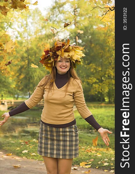 The cheerful girl on rest in autumn park