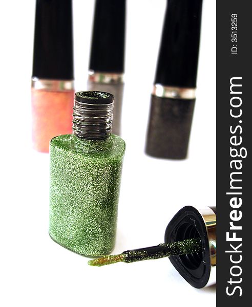 Green nail polish or lipstick on white background