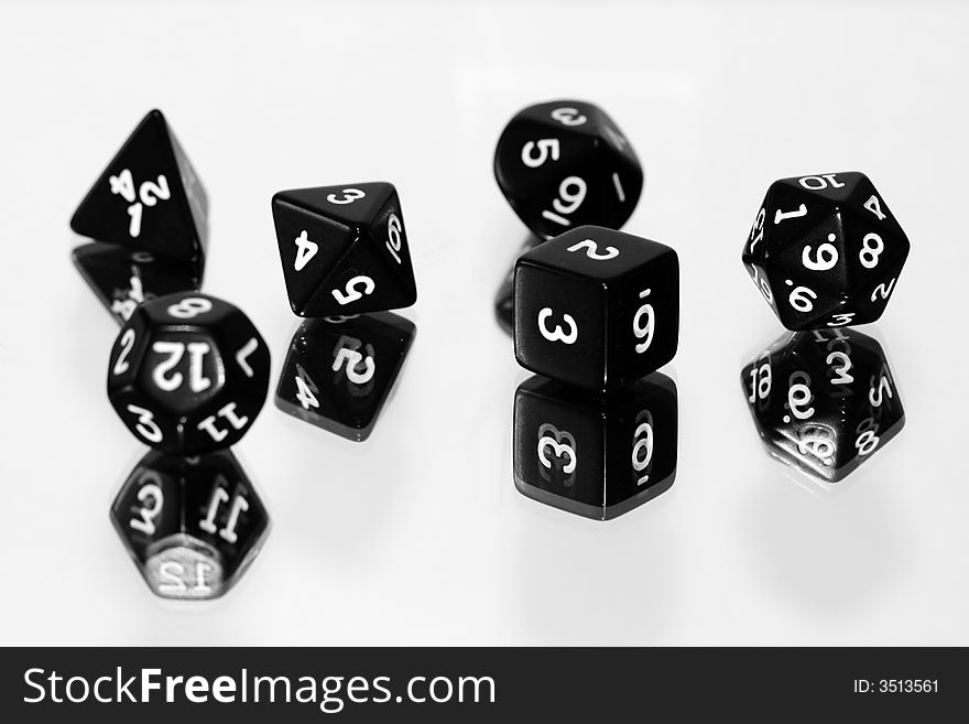 Black dice on white background - shallow depth of field