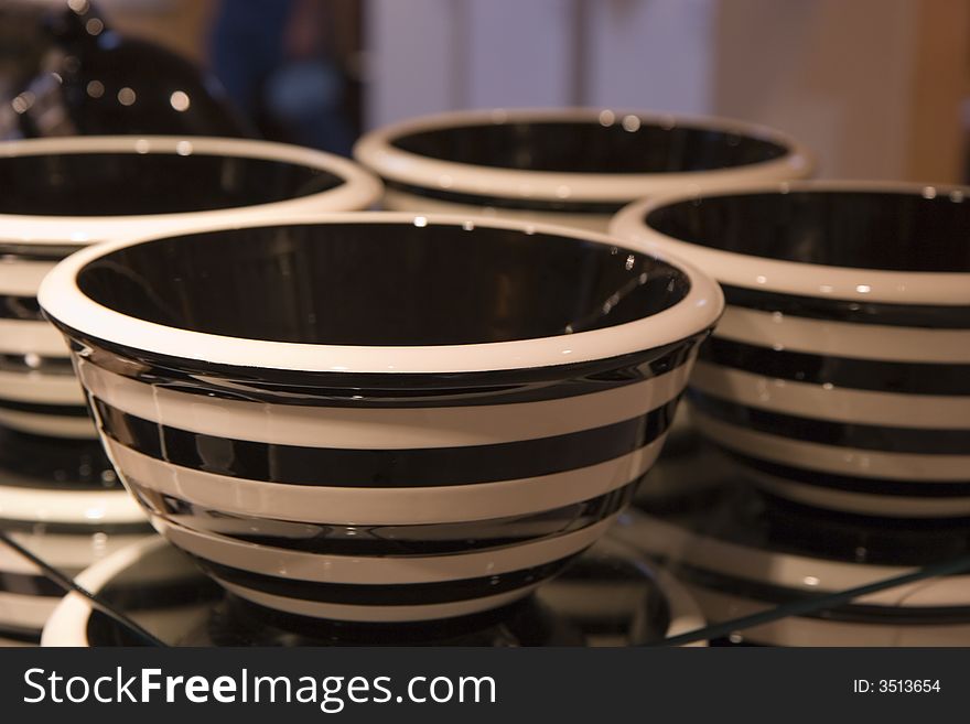 Stacks of ceramic black and white bowls in retail store