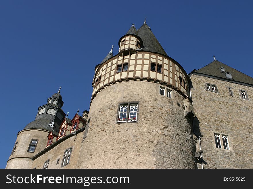 Medieval castle in Germany standing in the bright sunlight of a clear autumn day. Medieval castle in Germany standing in the bright sunlight of a clear autumn day