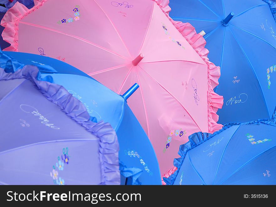 A collection of personalized parasols in many pastel colors