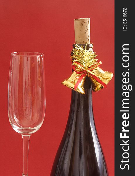Bottle of champagne with bells and glass. Bottle of champagne with bells and glass