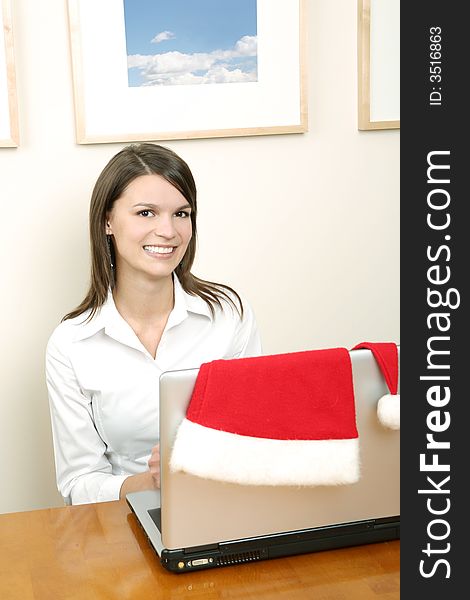 Christmas time  - female santa with a laptop