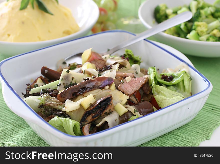 Healthy and light mushroom, fresh lettuce, brinjal and sliced grilled beef salad