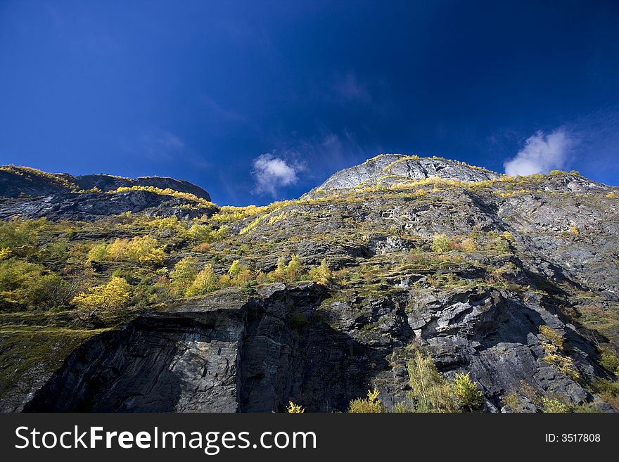 High Moutain with autumn colors and blue sky