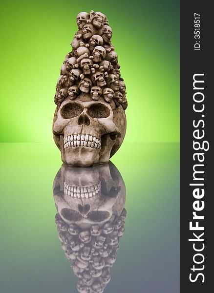 Halloween skull reflections on green color