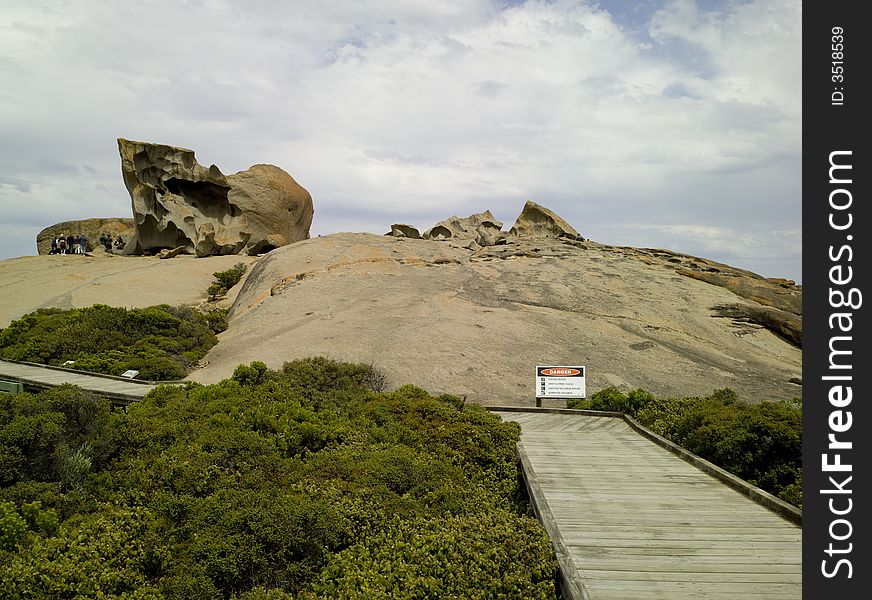 Dusk sets in on a cloudy day at Remarkable Rocks - a natural group of rock formations shaped by erosion of years of sand and surf hitting them. (South Australia)