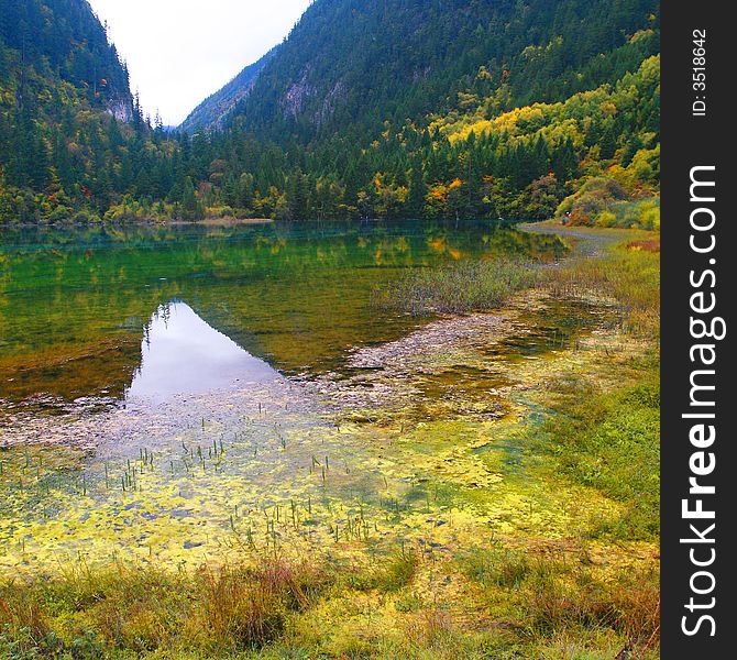 Beautiful lake surround by mountain with colorful trees. Beautiful lake surround by mountain with colorful trees.