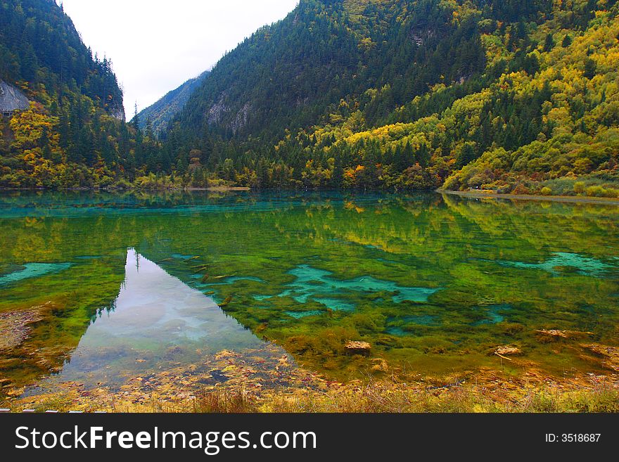 Beautiful lake surround by mountain with colorful trees. Beautiful lake surround by mountain with colorful trees.