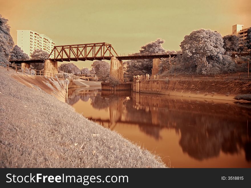 Infrared photo â€“ tree and railway bridge in the parks. Infrared photo â€“ tree and railway bridge in the parks