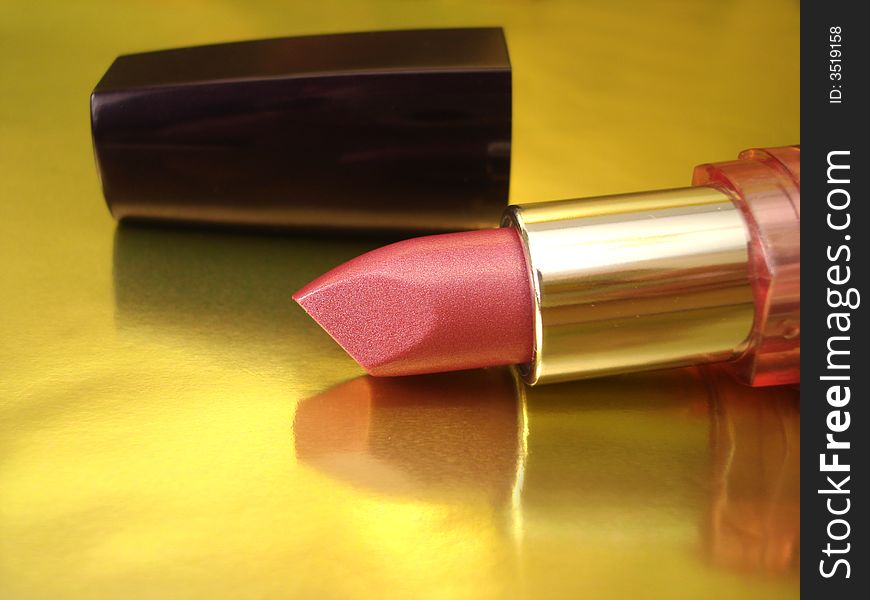 Pink lipstick on golden