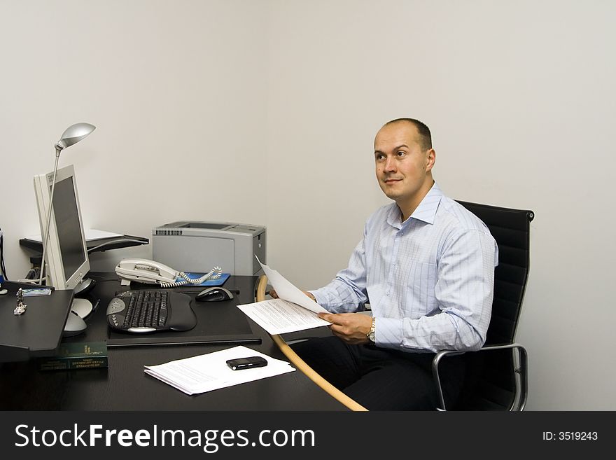 Businessman working with papers at office