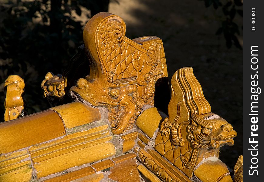 Edge of a chinese temple roof with little figures on it. Edge of a chinese temple roof with little figures on it