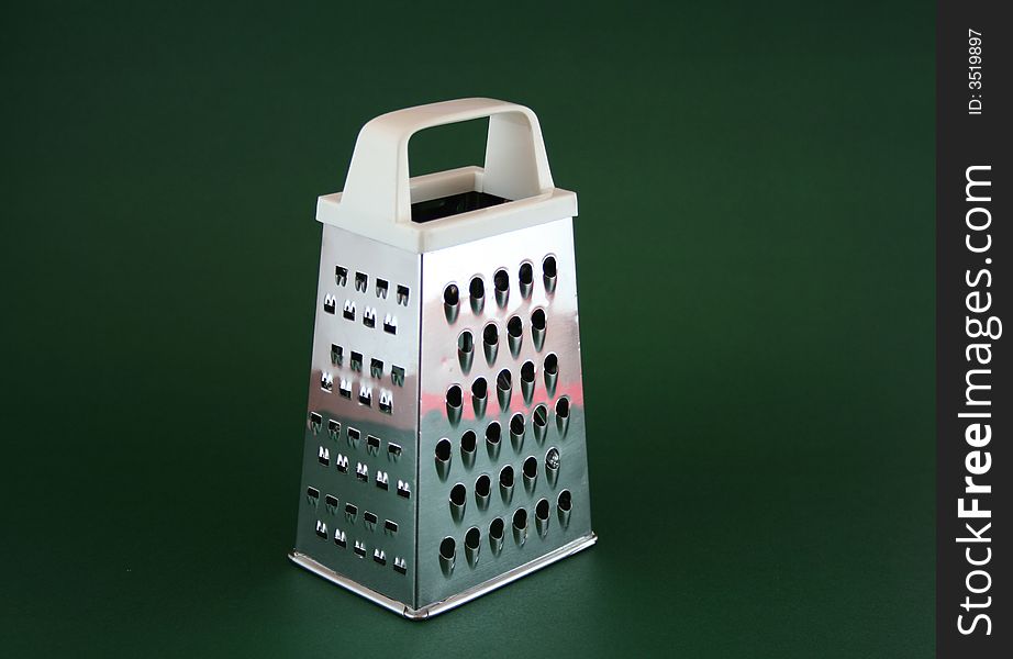 Grater on green background in light tent. Grater on green background in light tent