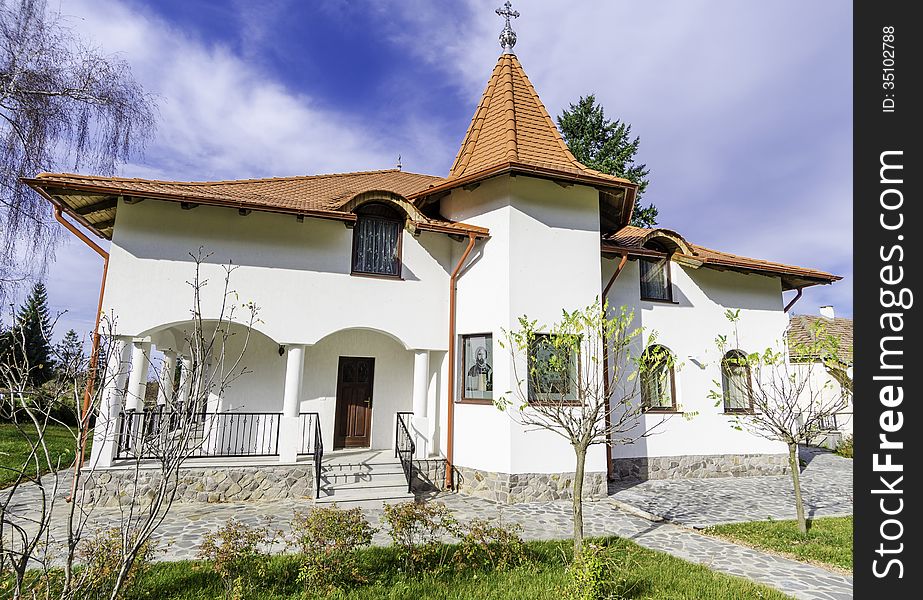 A small cottage in the Sambata Monastery resort - in the heart of Carpathian chain of mountains - a sunny autumn sunday right after the liturgy. These cottages were built by the monks for the monks and they serve as private conventicles and hermitage. A small cottage in the Sambata Monastery resort - in the heart of Carpathian chain of mountains - a sunny autumn sunday right after the liturgy. These cottages were built by the monks for the monks and they serve as private conventicles and hermitage.