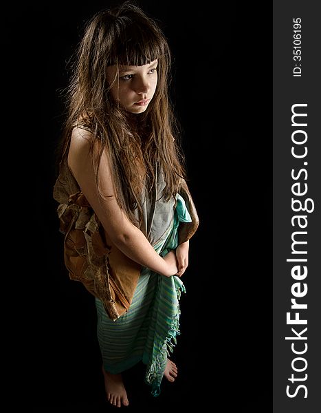 Girl In Rags, Barefoot On Black Background
