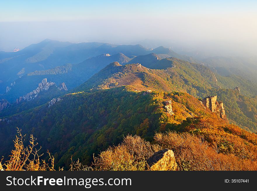 The photo taken in Chinas Hebei province qinhuangdao city,Zu mountain scenic spot.The time is October 3, 2013.Overlook hills from the Apsara peak of Zu mountain. The photo taken in Chinas Hebei province qinhuangdao city,Zu mountain scenic spot.The time is October 3, 2013.Overlook hills from the Apsara peak of Zu mountain.