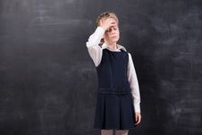 Schoolgirl With Headache Stands At The Blackboard Stock Photo Schoolgirl With Headache Stands At The Blackboard Stock Photo