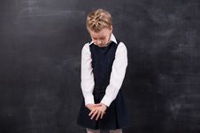 Sad Little Schoolgirl Near Blackboard Royalty Free Stock Images Sad Little Schoolgirl Near Blackboard Royalty Free Stock Images
