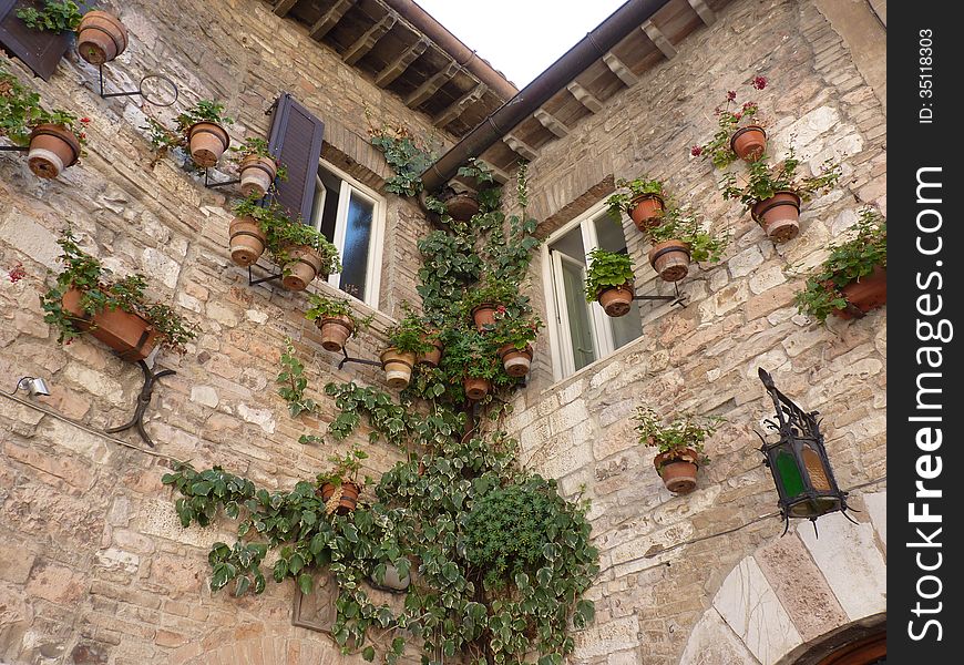 A house in San Marino decorated with pots of flowers. A house in San Marino decorated with pots of flowers