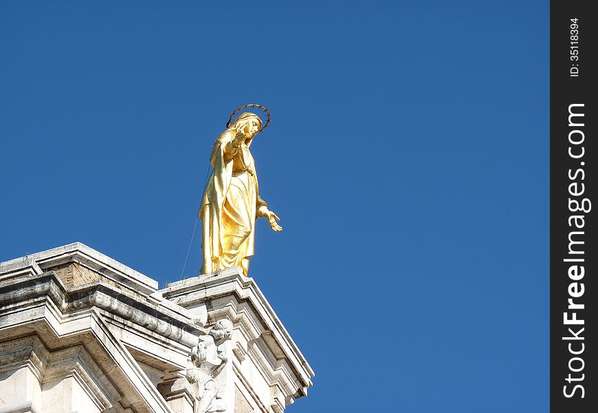 The Golden statue of Saint Mary of the Angels at the Basilica in Assisi