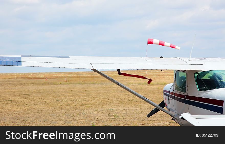 Steppe. Overcast. The shadow of a cloud moving. A small plane. Small helicopter flying in the background. Steppe. Overcast. The shadow of a cloud moving. A small plane. Small helicopter flying in the background