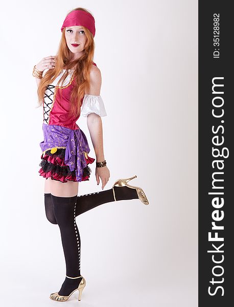 An image of an attractive young woman in a pirate costume. An image of an attractive young woman in a pirate costume