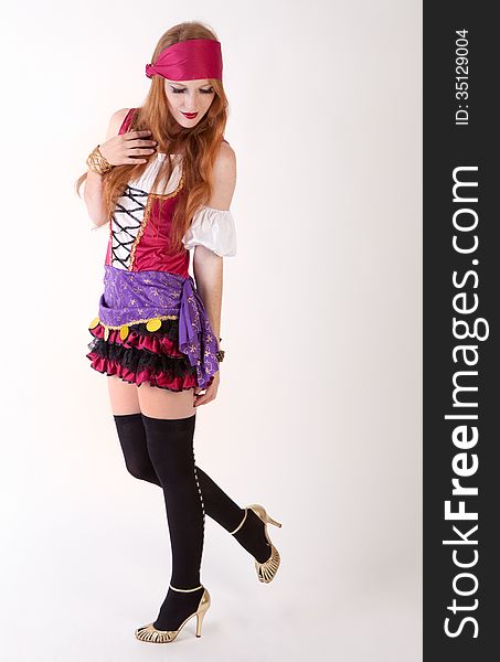 An image of a young woman dressed in a pirate costume. An image of a young woman dressed in a pirate costume