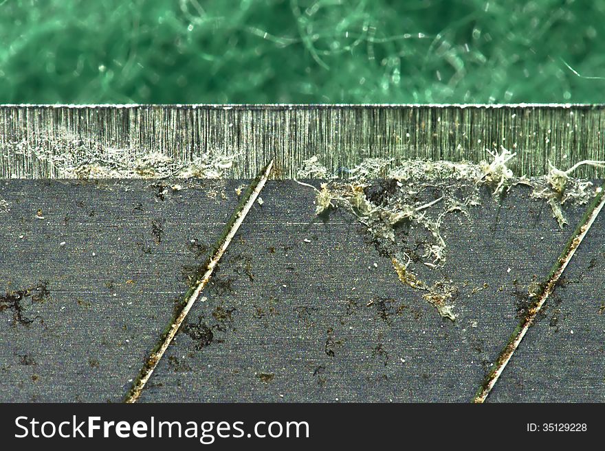 Macro shot for the sharp edge of a paper cutter. Macro shot for the sharp edge of a paper cutter.