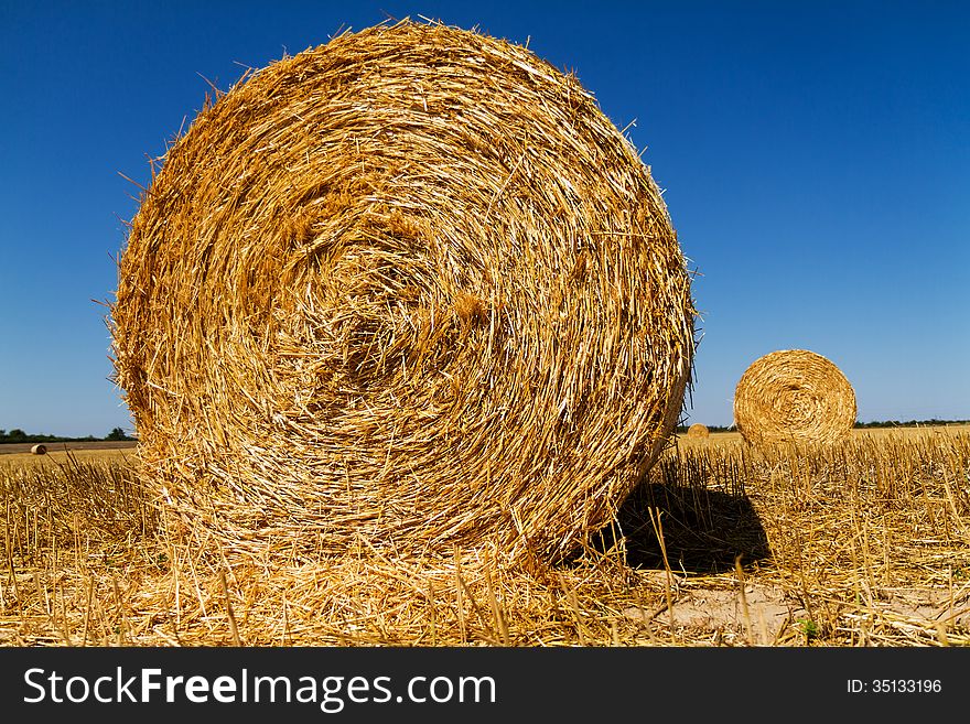 Straw bales in the light of sunset